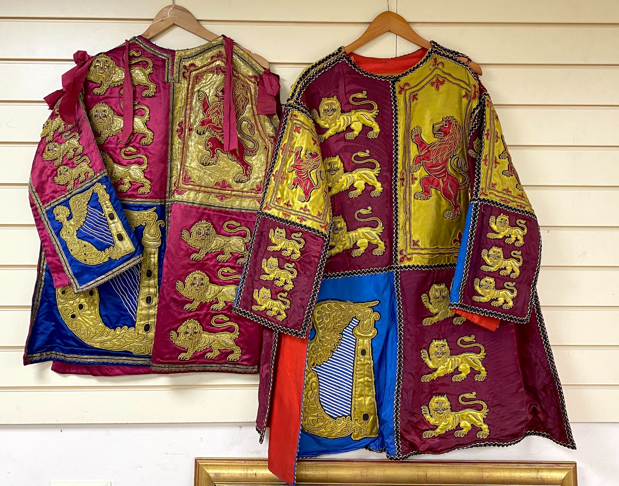 Two QEII Officer's of Arms of The Herald's College embroidered tabards and a similar silk garter, possibly worn for the Coronation of the Queen in 1953